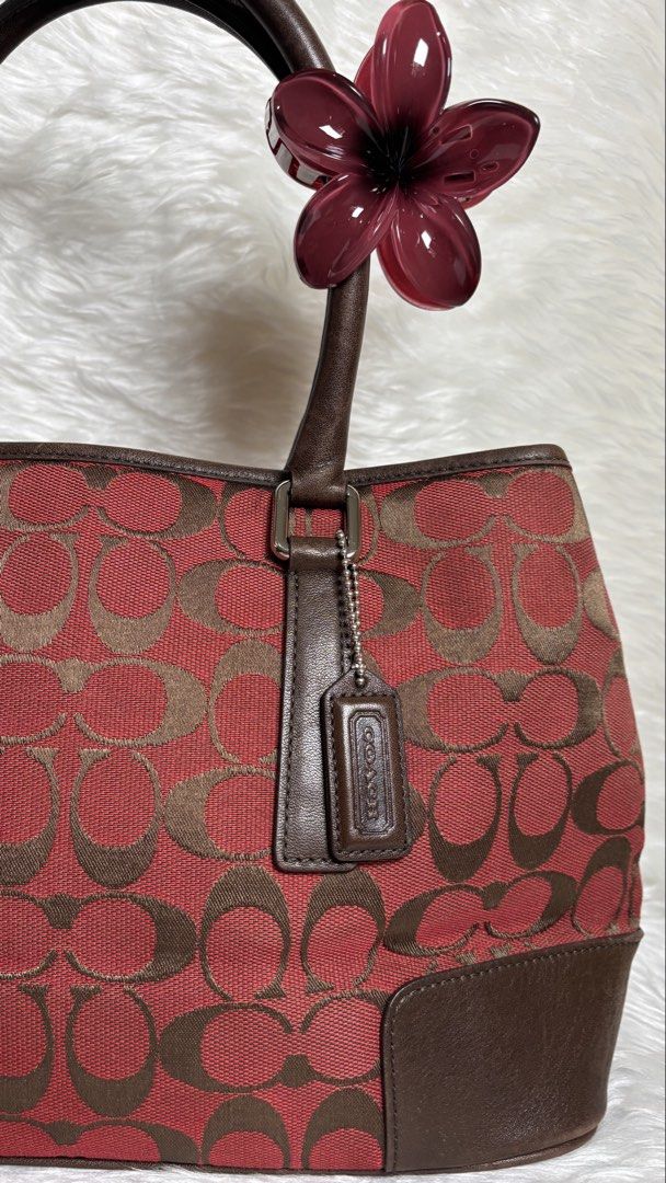 Coach Signature Canvas Tote Bag (Category: Shoulder Bags) located in Manila. Submitted by vintage_og_bagash (Listing ID 1461163586, Image 2). Description: ❤️🤎 BURGUNDY + BROWN = RICH GIRL VIBES. 😮‍💨✨ Vintage Coach Signature Tote — ang classy, sis! 👜 Minimal scratches lang. Still super gorg! 📩 DM to claim!.