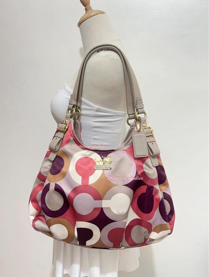 Coach Signature Madison Shoulder Bag (Category: Luxury Bags & Wallets) located in San Fernando. Submitted by curatedfinds_ (Listing ID 1461238194, Image 1). Description: cch madison multi color hobo bag auth vintage, med size condition: 8/10 dimension: approximately 9.5 x 14 inches minimal dirts & minimal signs of use.