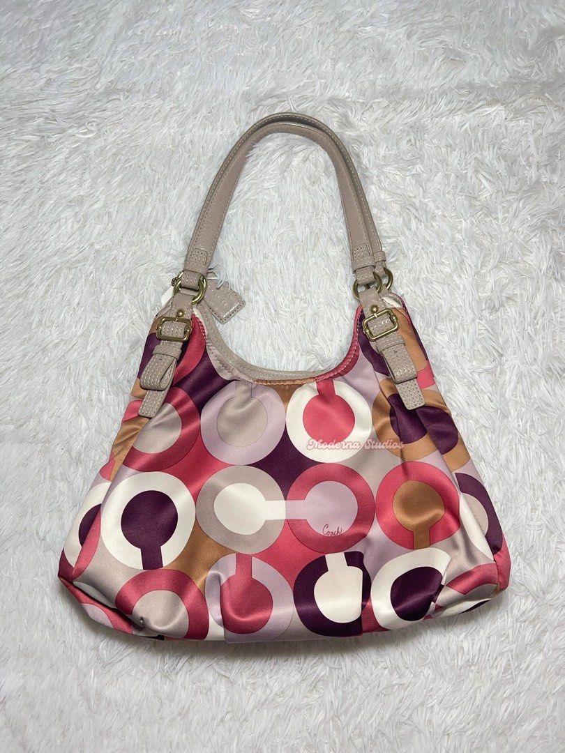 Coach Signature Madison Shoulder Bag (Category: Luxury Bags & Wallets) located in San Fernando. Submitted by curatedfinds_ (Listing ID 1461238194, Image 2). Description: cch madison multi color hobo bag auth vintage, med size condition: 8/10 dimension: approximately 9.5 x 14 inches minimal dirts & minimal signs of use.