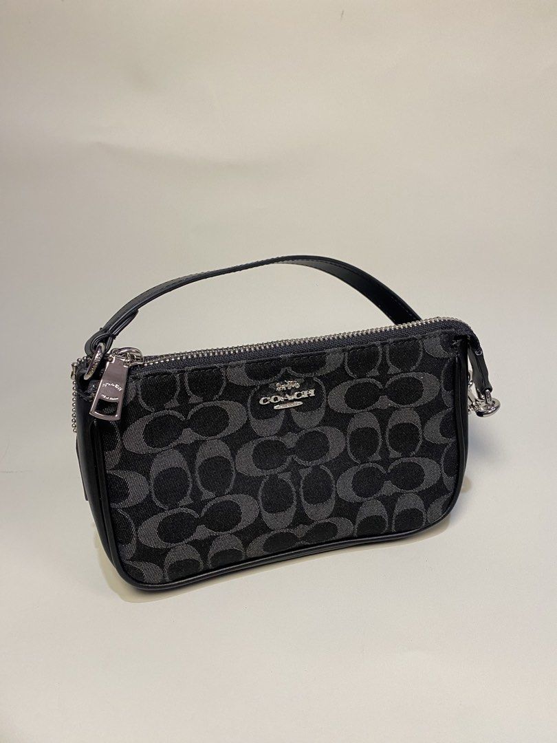Coach Signature Monogram Canvas Wristlet Pouch (Category: Luxury Bags & Wallets) located in General Santos City (Dadiangas). Submitted by jokk.x (Listing ID 1461323837, Image 1). Description: - Authentic Coach monogram canvas wristlet - Color: Black and Grey - Closure: Zip - Material: Leather strap and trim - Includes original Coach New York leather tag - Interior Coach logo tag with serial number - Small and compact, ideal for carrying essential