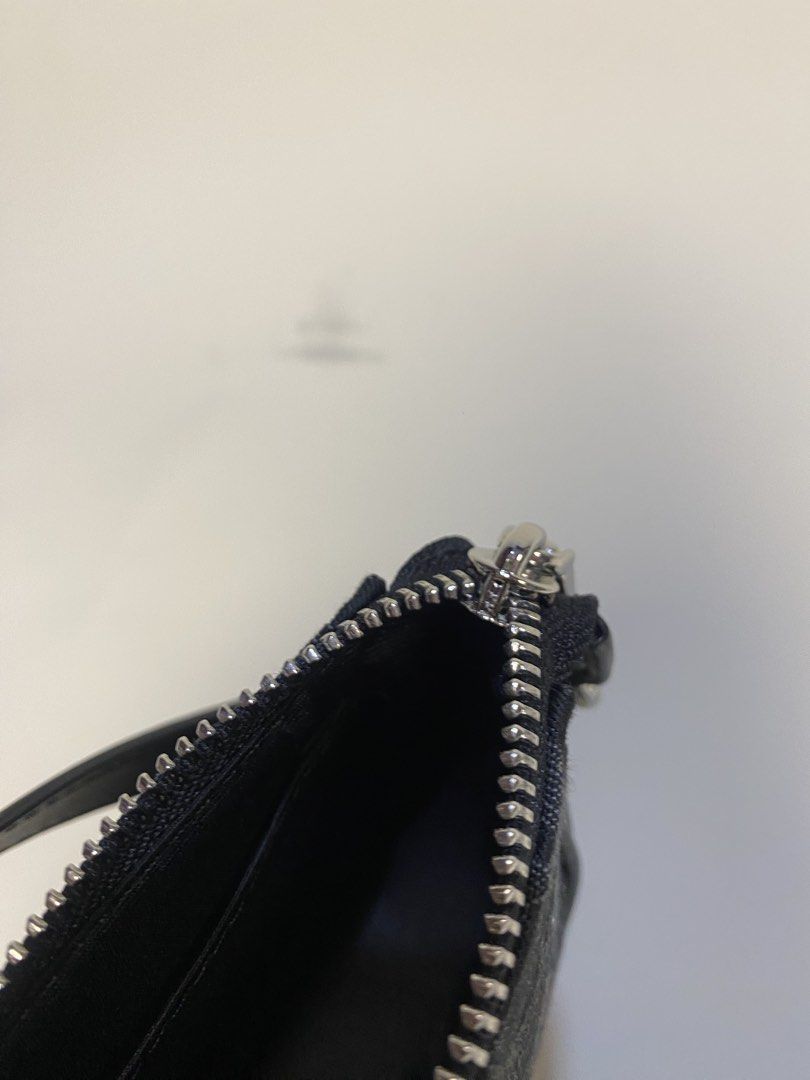 Coach Signature Monogram Canvas Wristlet Pouch (Category: Luxury Bags & Wallets) located in General Santos City (Dadiangas). Submitted by jokk.x (Listing ID 1461323837, Image 3). Description: - Authentic Coach monogram canvas wristlet - Color: Black and Grey - Closure: Zip - Material: Leather strap and trim - Includes original Coach New York leather tag - Interior Coach logo tag with serial number - Small and compact, ideal for carrying essential
