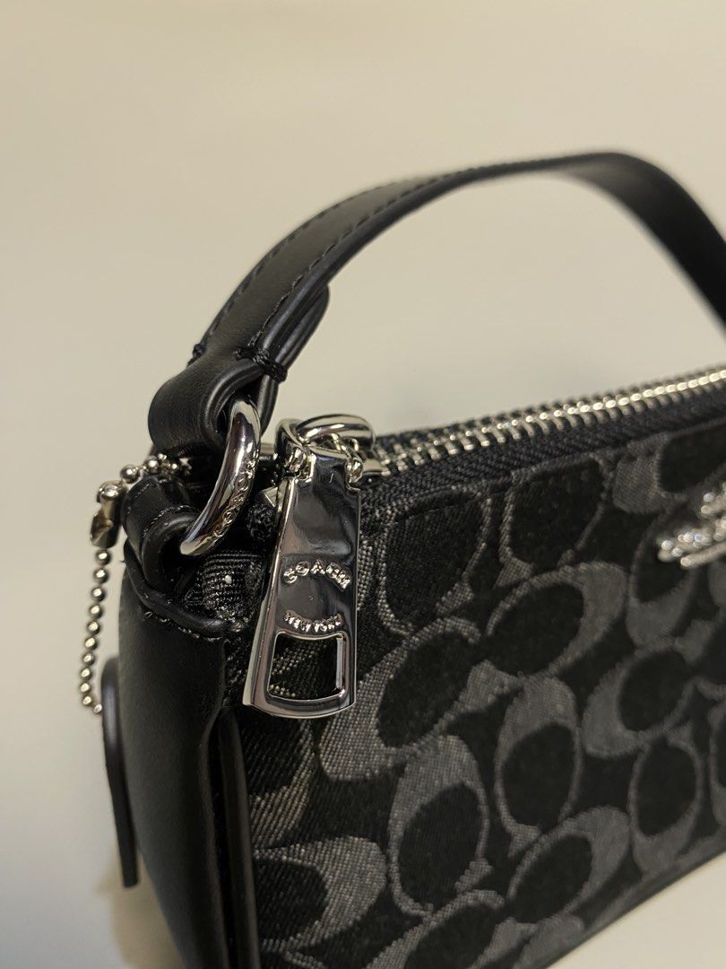 Coach Signature Monogram Canvas Wristlet Pouch (Category: Luxury Bags & Wallets) located in General Santos City (Dadiangas). Submitted by jokk.x (Listing ID 1461323837, Image 2). Description: - Authentic Coach monogram canvas wristlet - Color: Black and Grey - Closure: Zip - Material: Leather strap and trim - Includes original Coach New York leather tag - Interior Coach logo tag with serial number - Small and compact, ideal for carrying essential