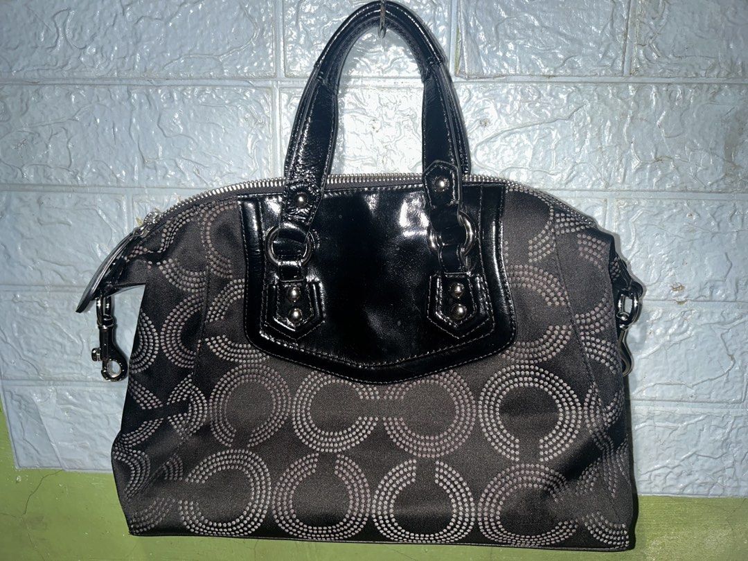 Coach Signature Monogram Hand Bag (Category: Luxury Bags & Wallets) located in Manila. Submitted by toastedcashew (Listing ID 1461176987, Image 2). Description: - Classic Coach tote bag - Black and grey signature monogram pattern - Black patent leather accents and handles - Interior zippered pocket and slip pockets - Serial number visible - Stylish everyday bag.