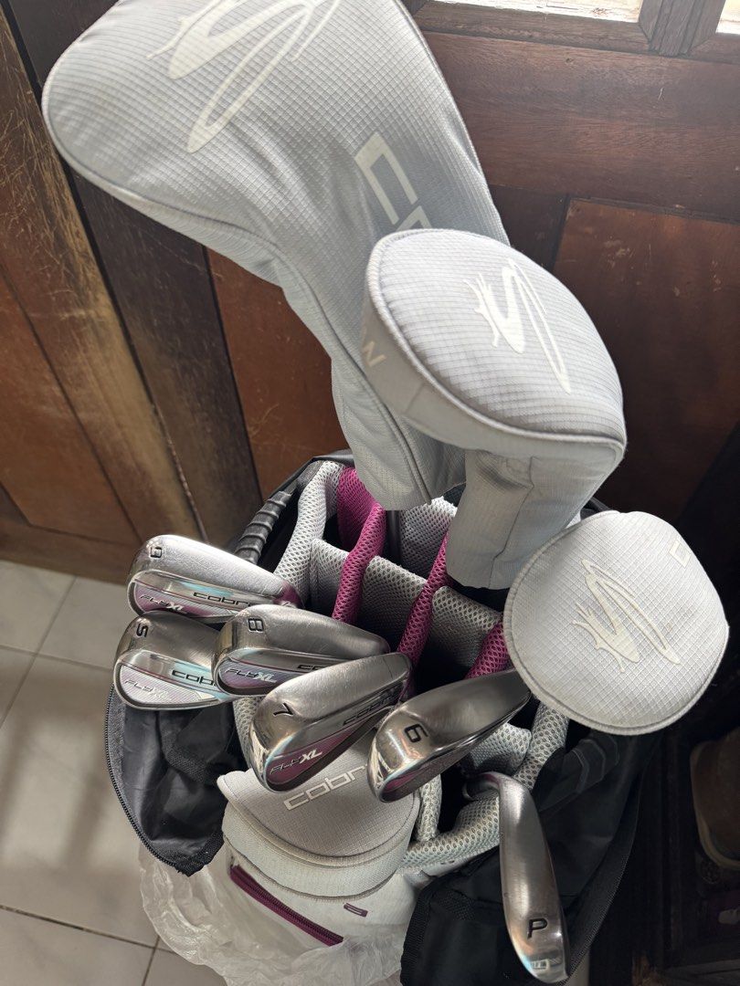 Cobra FlyXL Ladies Golf Set (Category: Golf) located in Rizal. Submitted by lzdizon (Listing ID 1461122541, Image 2). Description: Full set for Ladies Cobra golf clubs Includes: Driver, 5 Wood, 5 Hybrid, Irons (6, 7, 8, 9, Pitching Wedge), Putter - Comes with headcovers for the woods Features a durable Cobra stand bag with multiple compartments Ideal for golfers of all levels seeking a dependable set.