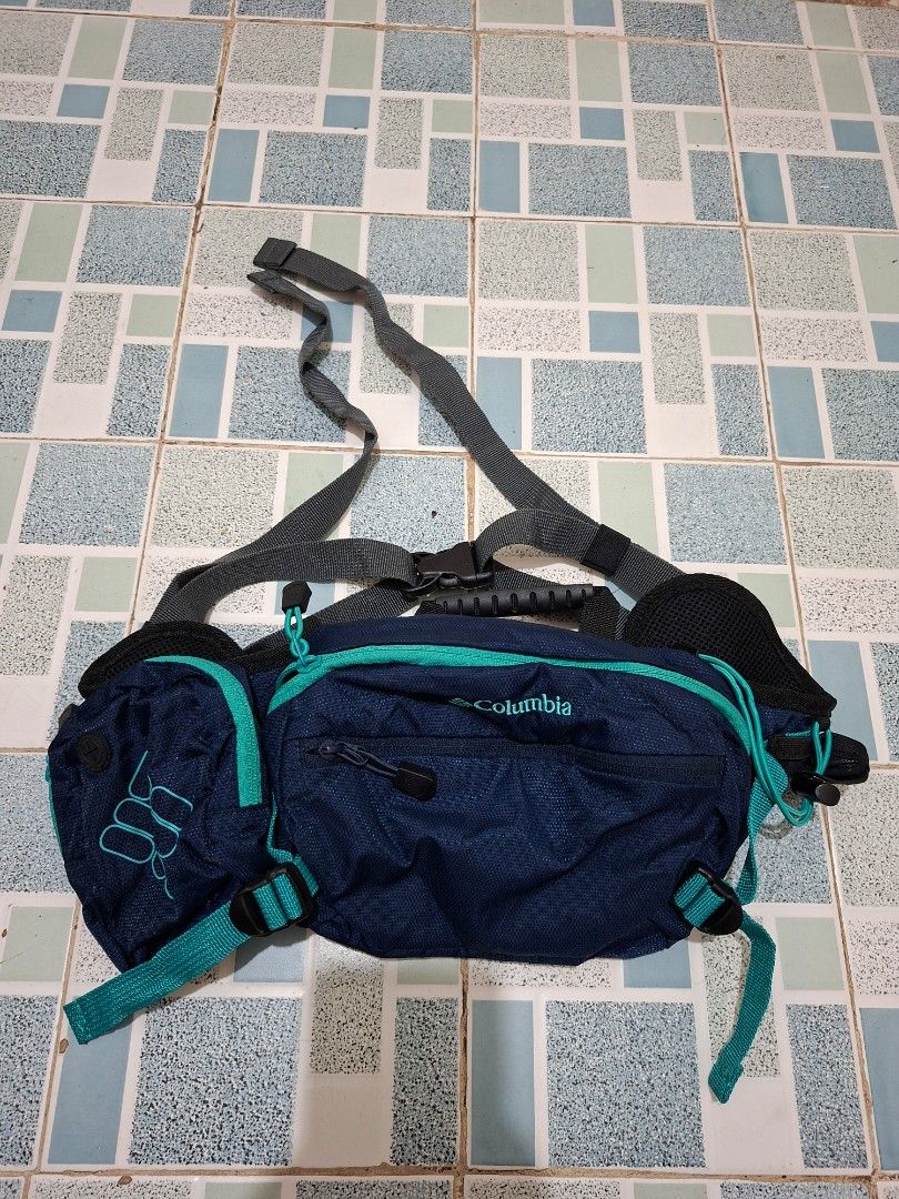 Columbia Navy Blue Hiking Backpack with Pouch (Category: Backpacks) located in Lapu Lapu. Submitted by margaux099 (Listing ID 1461303573, Image 2). Description: - Navy blue Columbia - Teal accents throughout - Detachable front pouch included - Adjustable straps for comfortable wear - Spacious interior for essentials - Zippers in excellent working condition - Ideal for hiking and day trips.