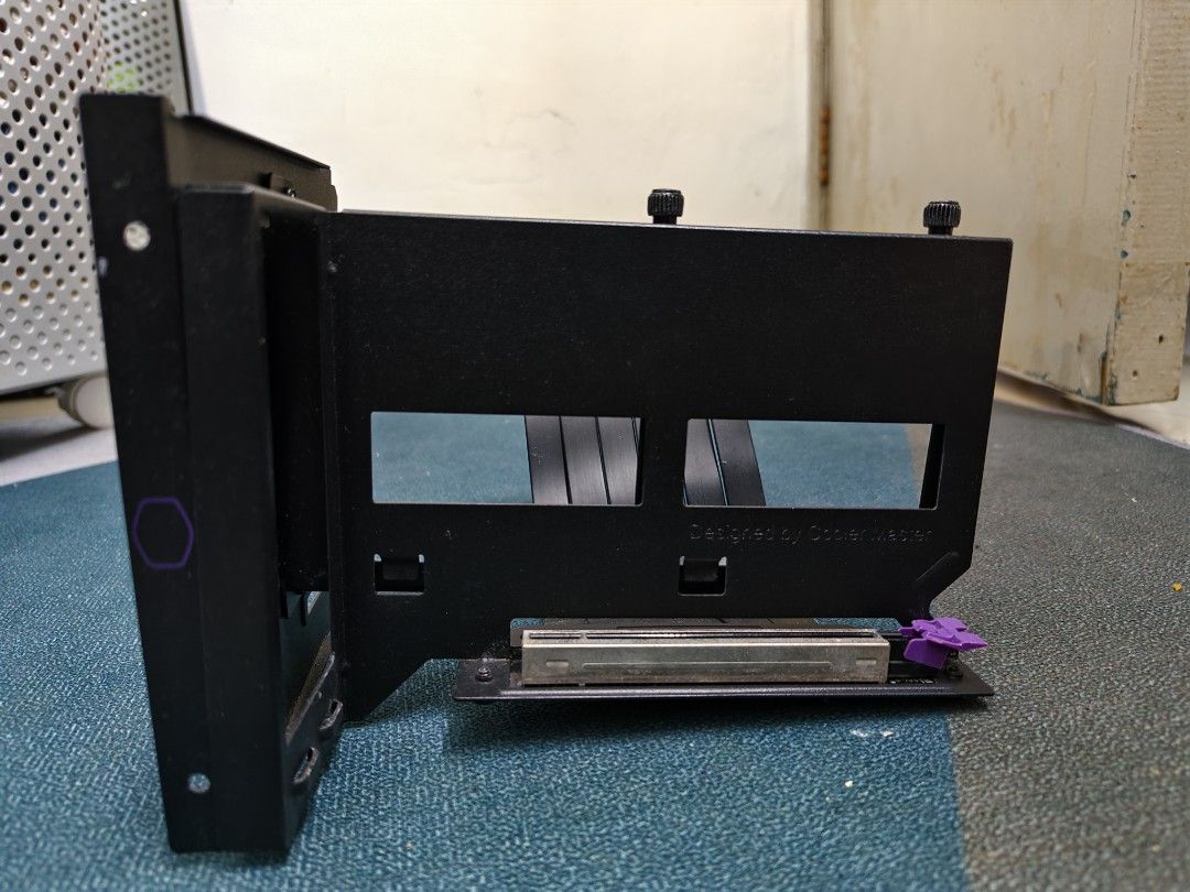Cooler Master PCIe Riser Cable Bracket (Category: Computer Parts) located in Kuala Lumpur. Submitted by nul_haqim (Listing ID 1461151272, Image 2). Description: - Cooler Master Vertical GPU Mount - Includes riser cable and bracket - Allows vertical graphics card installation - Black finish - Minor scuffs on bracket from installation - Tested and working - Nego till let go .