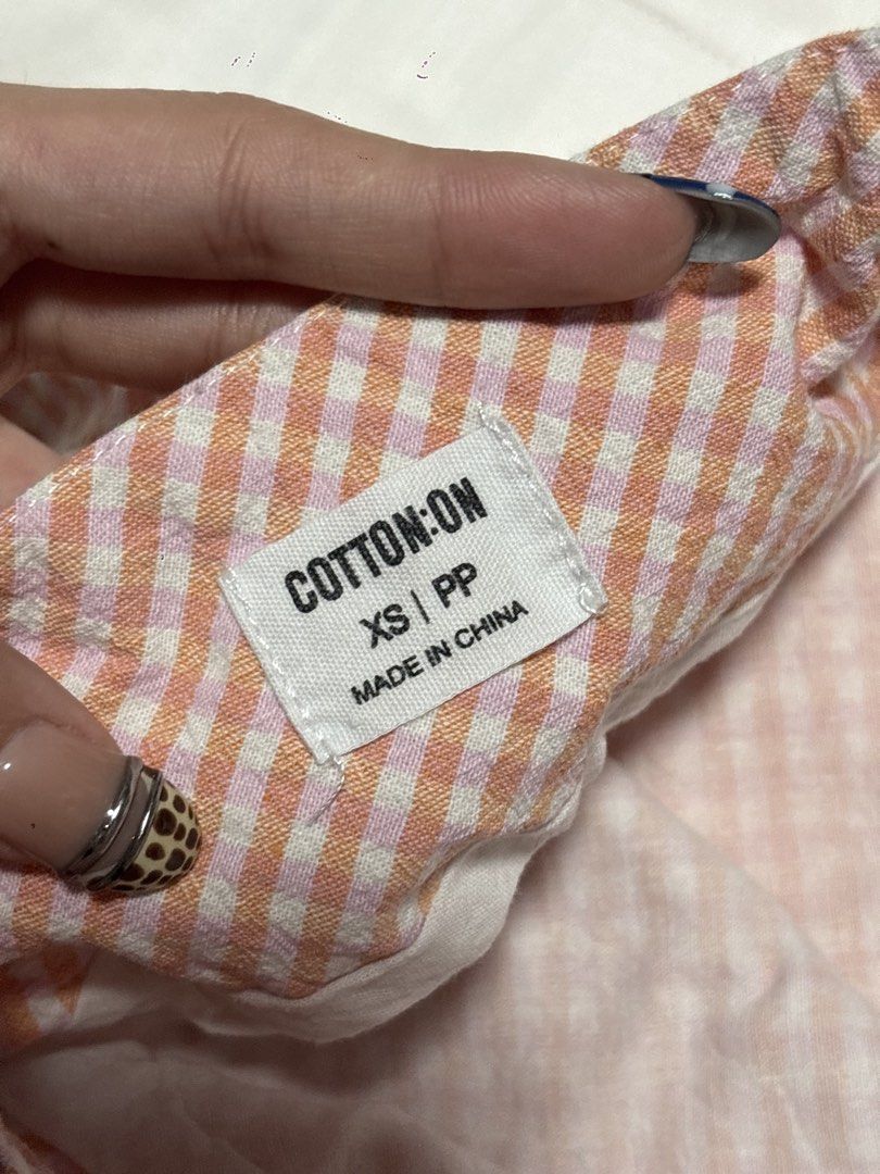 Cotton On Gingham Mini Skirt XS (Category: Skirts) located in Pasay City. Submitted by nicoletlntn_ (Listing ID 1461236018, Image 2). Description: - Adorable pink and white gingham pattern - Brand: Cotton On - Size: XS - Style: Mini skirt - Perfect for casual wear - Versatile and easy to pair with different tops.