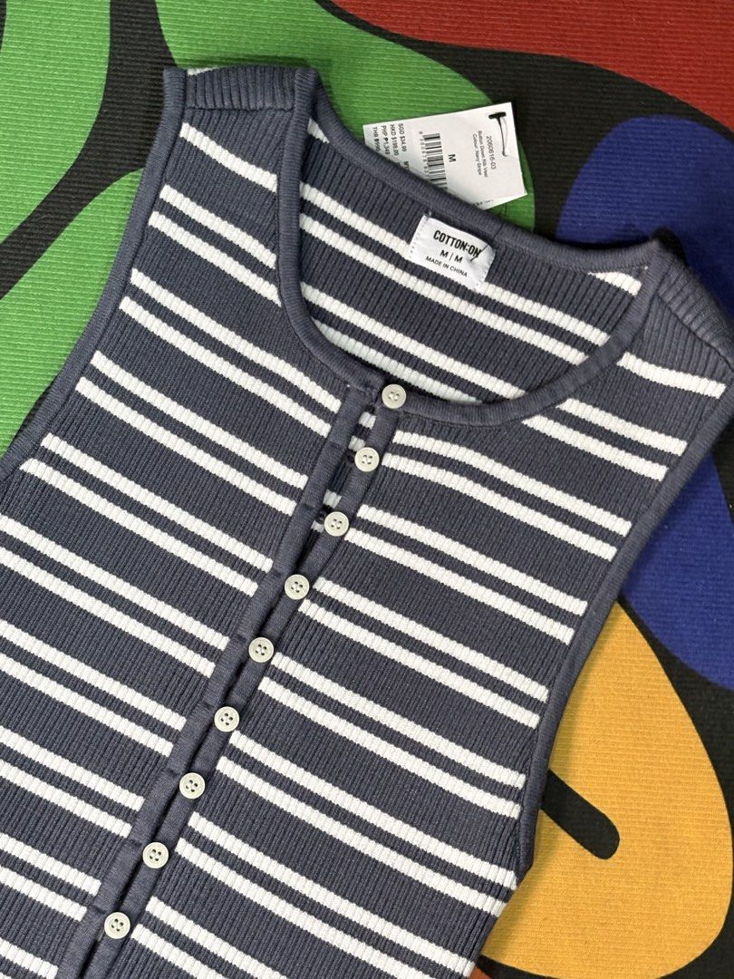 Cotton On Navy Stripe Button Down Rib Vest M (Category: Sleeveless) located in Orani. Submitted by leannejoyful (Listing ID 1461285834, Image 3). Description: - Navy and white striped ribbed vest - Brand: Cotton On - Button-down front - Sleeveless design - Versatile: great for layering or wearing on its own - Pairs perfectly with jeans - Size: Medium (M).