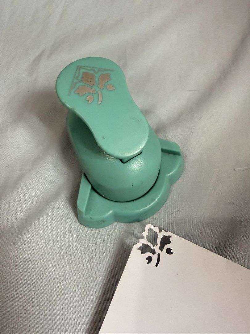 Craft Corner Punch - Floral Design (Category: Craft Supplies & Tools) located in Las Pinas. Submitted by cherrichigo (Listing ID 1461160482, Image 1). Description: - Teal corner punch creates a beautiful floral design on paper edges. - Ideal for scrapbooking, card making, and other paper crafts. - Simple to use: insert paper and press. - Adds a decorative floral cut-out pattern to your projects. Pick-up only Location: Las Piñas.
