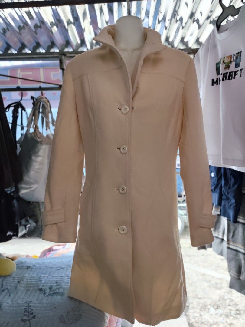 Cream Button-Up Long Coat (Category: Coats, Jackets and Outerwear) located in Manila. Submitted by gelvy1316 (Listing ID 1461133048, Image 1). Description: - Cream-colored long coat - Button-up front with a collared neckline - Features convenient front pockets - Sleeves with button details at the cuffs - Ideal for cooler weather.