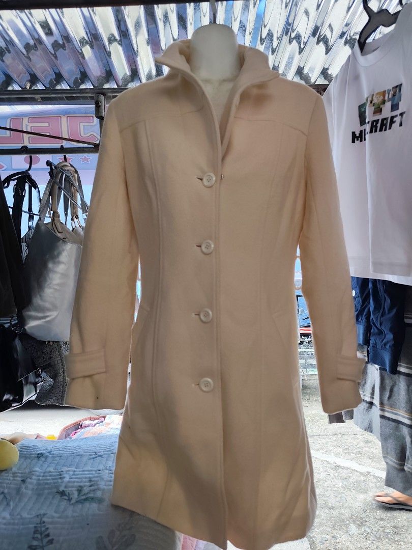 Cream Button-Up Long Coat (Category: Coats, Jackets and Outerwear) located in Manila. Submitted by gelvy1316 (Listing ID 1461133048, Image 2). Description: - Cream-colored long coat - Button-up front with a collared neckline - Features convenient front pockets - Sleeves with button details at the cuffs - Ideal for cooler weather.