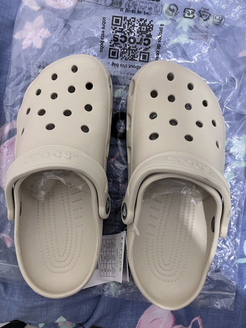 Crocs Classic Clog Bone (Category: Loafers) located in Antipolo. Submitted by euntak (Listing ID 1461149273, Image 2). Description: - Classic Crocs clogs in a neutral bone color. - Easy slip-on and off design. - Ventilation ports for breathability and water drainage. - Lightweight and comfortable with Iconic Crocs Comfort™. - Perfect for everyday wear, beach trips, or lounging. M5/W7 23.5-24cm Rfs-not my size.