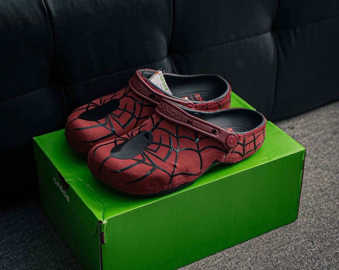 Crocs Spider-Man Clogs - Red & Black (Category: Slippers & Slides) located in Baguio. Submitted by authenticity1of1 (Listing ID 1461260785, Image 1). Description: - Spider-Man themed Crocs - Available in Red with black web design or All Black with web design - Classic Crocs comfort and style - Ideal for any Marvel fan - Comes with original box.