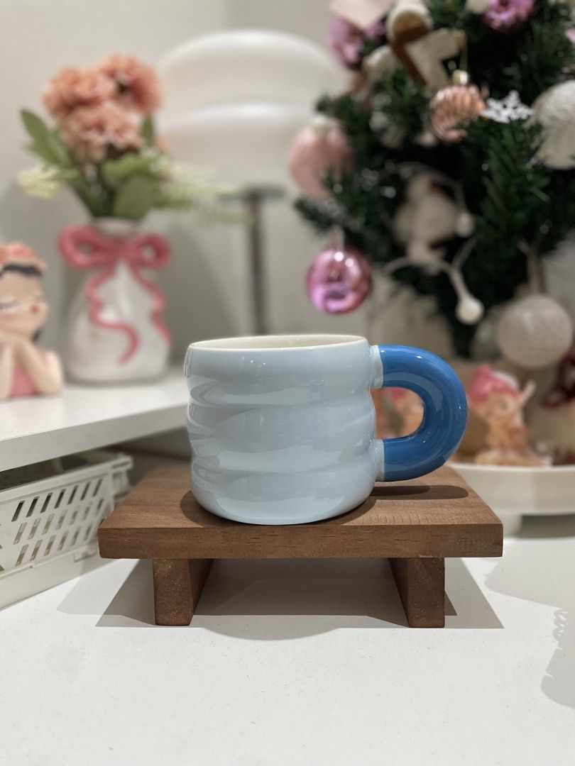 Cute light blue mug with blue handle (Category: Coffee & Tea Tableware) located in Quezon City. Submitted by mugs.meowph (Listing ID 1461275313, Image 1). Description: - Adorable light blue mug with a unique ribbed texture. - Features a comfortable, chunky blue handle. - Ideal for your morning coffee or tea. - Makes a wonderful gift! - Dimensions: Approx. [insert height] tall x [insert diameter] wide..