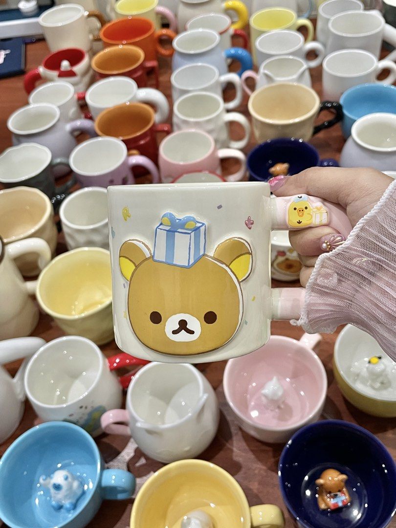 Cute Rilakkuma Bear Mug with Pink Handle (Category: Coffee & Tea Tableware) located in Quezon City. Submitted by mugs.meowph (Listing ID 1461274679, Image 2). Description: - Adorable Rilakkuma mug design - Features a blue gift box on its head - Little chick detail on the handle - Pretty pastel pink handle - Ideal for morning coffee or tea - A must-have for any Rilakkuma fan!.