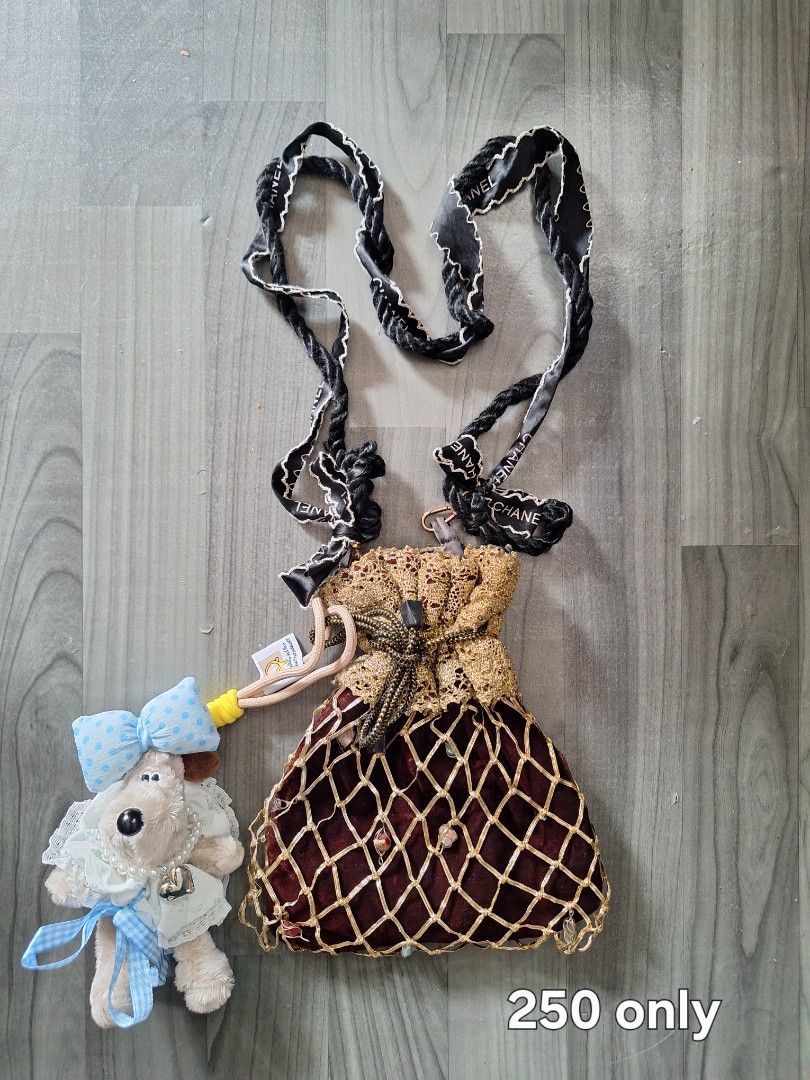 Cute Teddy Bear Charm Drawstring Pouch Bag (Category: Purses & Pouches) located in Manila. Submitted by irramay0064845 (Listing ID 1461164007, Image 2). Description: - Super cute pouch bag with fluffy trim - Detachable teddy bear charm - Long strap included - Perfect for small essentials - Comes with a second, more ornate pouch bag - Second pouch has a different charm - Both bags are unique and eye-catching.