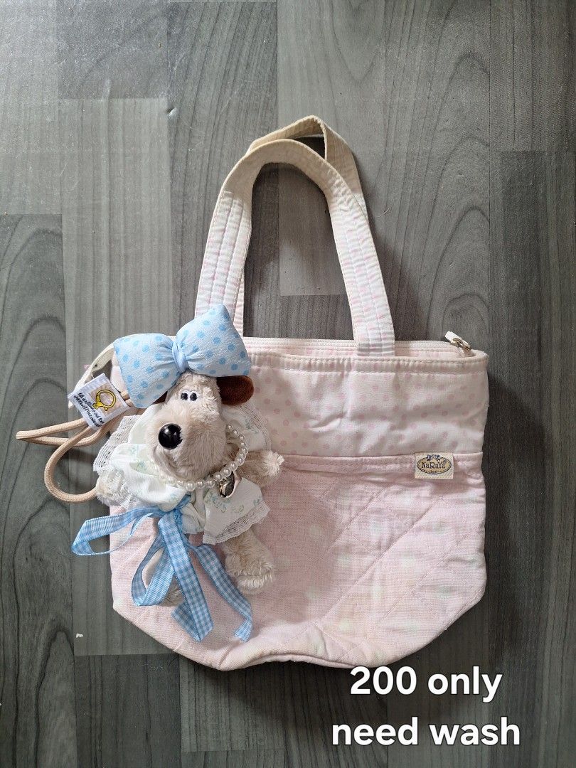 Cute Teddy Bear Charm Drawstring Pouch Bag (Category: Purses & Pouches) located in Manila. Submitted by irramay0064845 (Listing ID 1461164007, Image 3). Description: - Super cute pouch bag with fluffy trim - Detachable teddy bear charm - Long strap included - Perfect for small essentials - Comes with a second, more ornate pouch bag - Second pouch has a different charm - Both bags are unique and eye-catching.