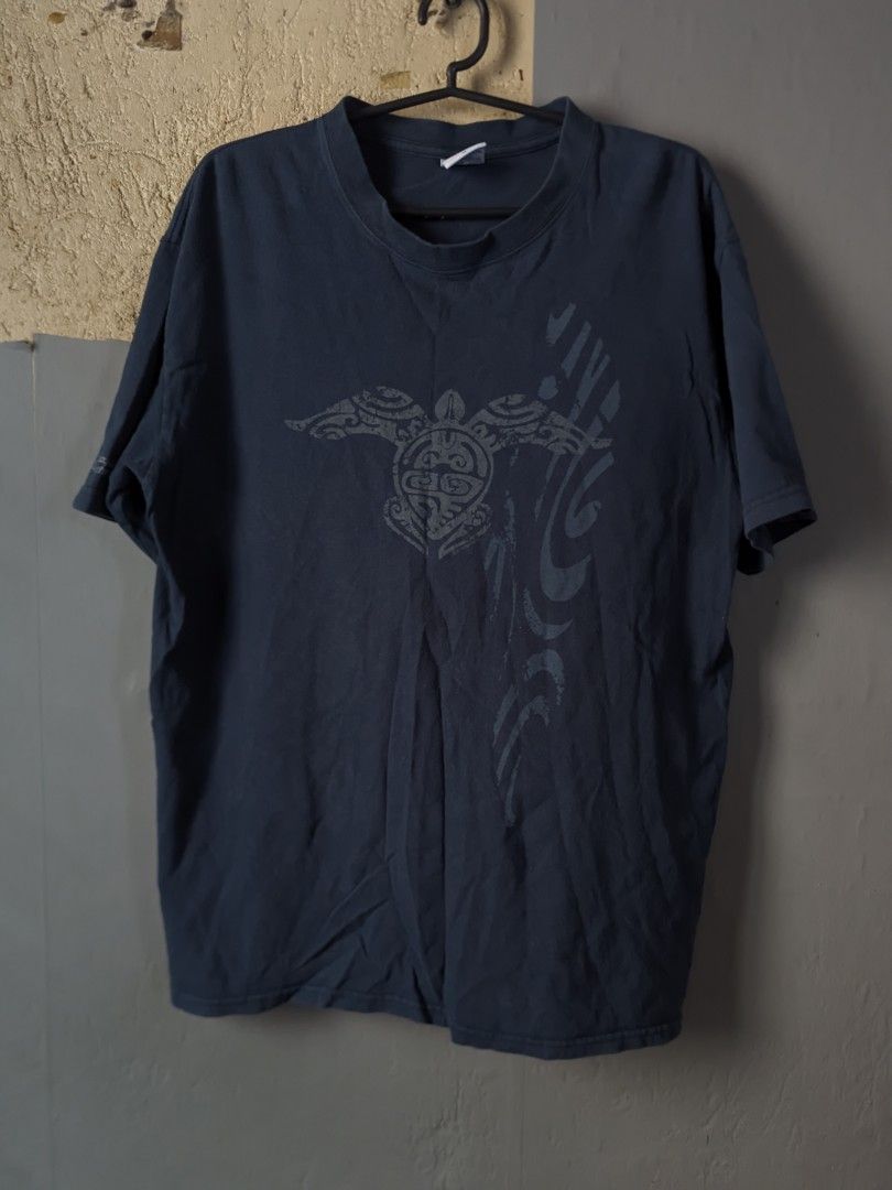 Dark Blue T-shirt with Turtle Graphic (Category: Tshirts & Polo Shirts ) located in Manila. Submitted by andreiming84756 (Listing ID 1461191838, Image 1). Description: - Cool dark blue t-shirt - Features a tribal-style turtle graphic on the front - Abstract tribal designs on the right side - Short sleeves and classic crew neck - Comfortable fit, perfect for casual wear.