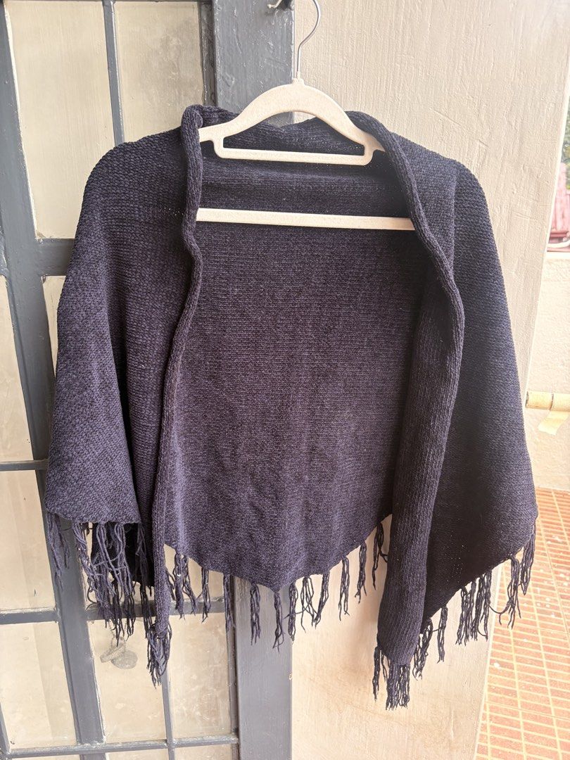 Dark Navy Knit Poncho with Fringe (Category: Coats, Jackets and Outerwear) located in Cainta. Submitted by declutteringprelovedbyzelle (Listing ID 1461247156, Image 1). Description: - Cozy dark navy knit poncho - Features stylish fringe detail along the hem - Easy to wear over any outfit - Provides extra warmth and style - Ideal for layering in cooler weather - A versatile addition to your wardrobe.