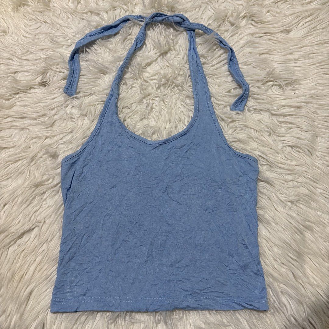 Dazy Blue Halter Neck Crop Top Size S (Category: Sleeveless) located in Davao. Submitted by elizzadiac (Listing ID 1461225991, Image 1). Description: - Cute blue halter neck crop top from Dazy - Ties at the neck and back for adjustable fit - Made of soft, slightly crinkled fabric - Versatile for casual wear or layering - Easily pairs with jeans or shorts.