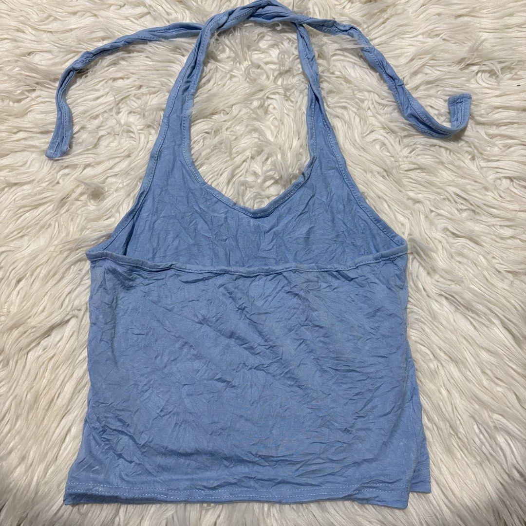 Dazy Blue Halter Neck Crop Top Size S (Category: Sleeveless) located in Davao. Submitted by elizzadiac (Listing ID 1461225991, Image 2). Description: - Cute blue halter neck crop top from Dazy - Ties at the neck and back for adjustable fit - Made of soft, slightly crinkled fabric - Versatile for casual wear or layering - Easily pairs with jeans or shorts.