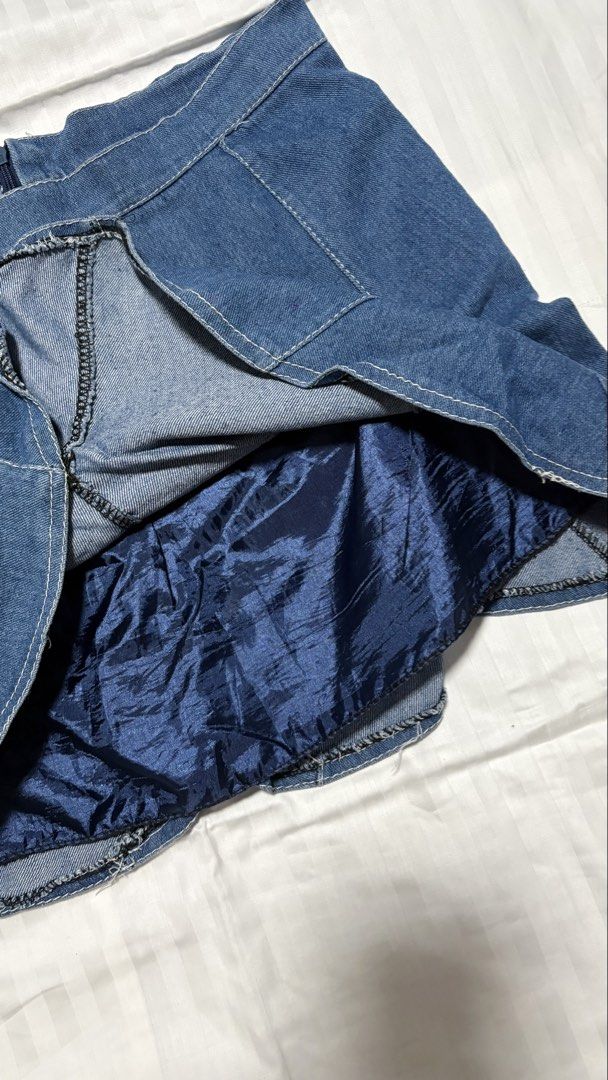 Denim Skirt with Inner Lining - Size L (Category: Skirts) located in Pasay City. Submitted by nicoletlntn_ (Listing ID 1461257715, Image 3). Description: - Blue denim skirt - Flared hem with panel detailing - Dark blue inner lining - Zipper closure at the back - Size L - Ideal for casual wear.