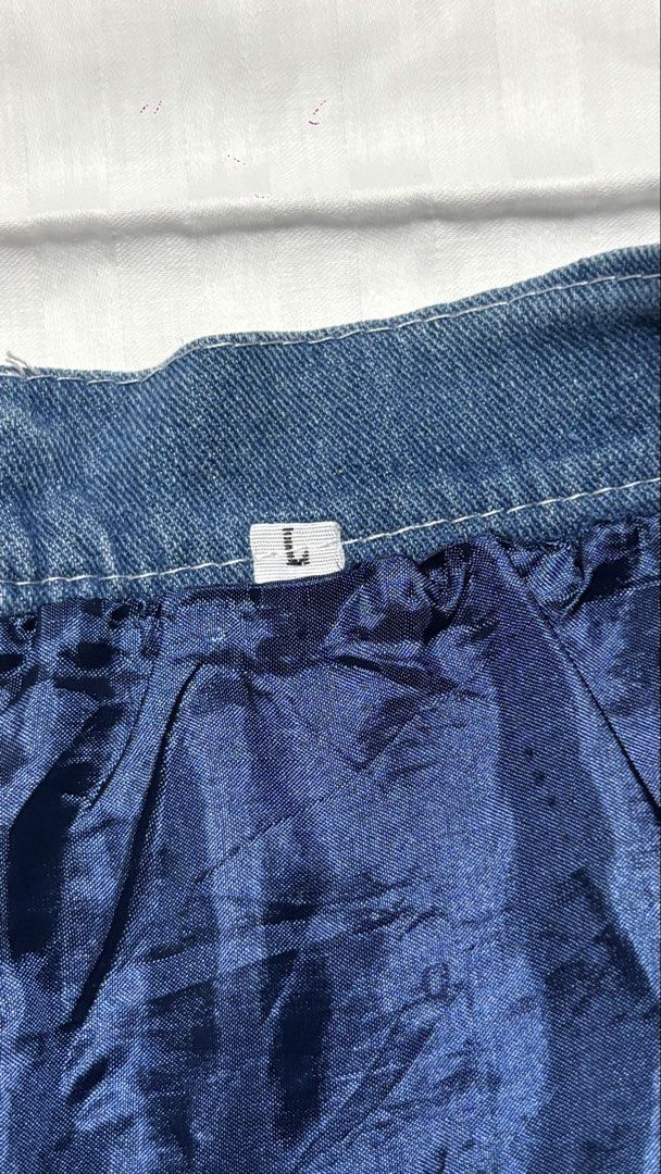 Denim Skirt with Inner Lining - Size L (Category: Skirts) located in Pasay City. Submitted by nicoletlntn_ (Listing ID 1461257715, Image 2). Description: - Blue denim skirt - Flared hem with panel detailing - Dark blue inner lining - Zipper closure at the back - Size L - Ideal for casual wear.