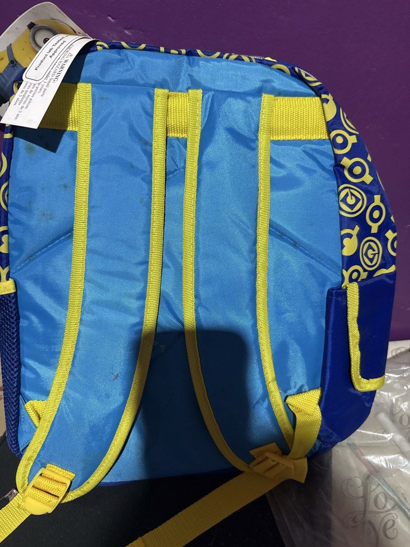 Despicable Me Minions Backpack (Category: Babies & Kids Fashion) located in Manila. Submitted by zealbear_602543 (Listing ID 1461188052, Image 1). Description: - Blue backpack with fun Minions graphic and 'I HONK for MINIONS' text. - Bright yellow straps for a pop of color. - Convenient side mesh pockets for water bottles or small items. - Perfect for school, day trips, or everyday use. - Shows some minor marks on the back straps, as pictured..