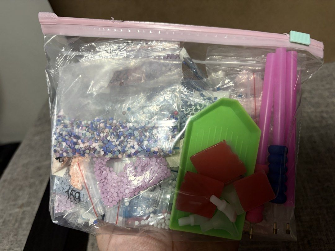 Diamond Painting Accessories Kit - Beads, Tools, Tray (Category: Craft Supplies & Tools) located in Tanza. Submitted by iamdhana (Listing ID 1461322626, Image 1). Description: For free, just buy anything from my listing. - Includes various colors of beads in small bags - Comes with a green tray - Includes red square pieces - Features pink diamond painting pens - All items packed in a resealable plastic bag - Perfect for your next diamond art proj