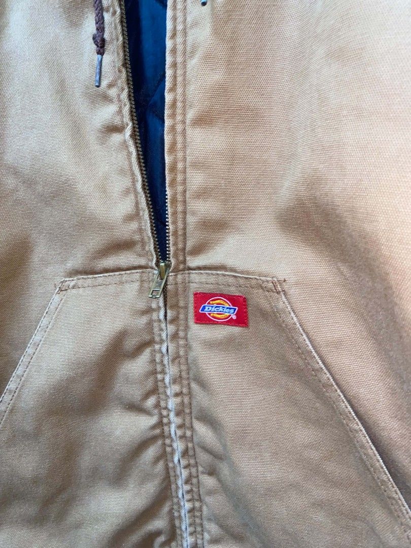 Dickies Insulated Hooded Work Jacket Tan (Category: Coats, Jackets and Outerwear) located in General Trias. Submitted by neloo1. (Listing ID 1461223699, Image 3). Description: vintage dickies active duck jacket - Classic tan Dickies work jacket - Insulated for warmth - Features a hood and front pocket - Durable canvas material - Ribbed cuffs and hem for a snug fit - Zipper closure - Ideal for work or casual wear.
