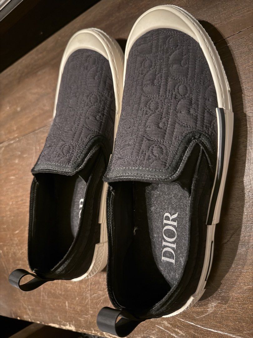 DiOR Slip-On Sneakers ❗️❗️❗️ (Category: Sneakers & Footwear) located in Manila. Submitted by hotdealsph (Listing ID 1461265976, Image 3). Description: - Authentic Dior slip-on sneakers - Features the iconic Dior all-over logo pattern - Comfortable white rubber sole - Easy slip-on design for convenience - Ideal for casual everyday wear.