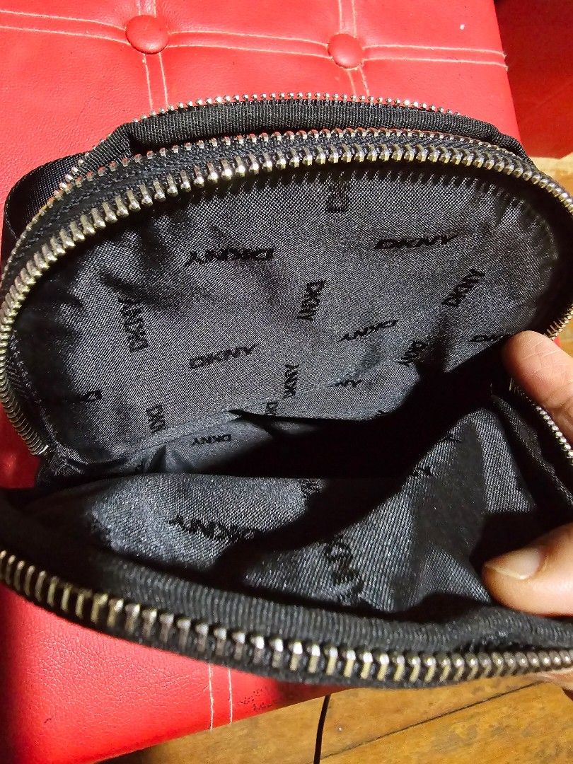 DKNY Black Nylon Crossbody Bag (Category: Cross-body Bags) located in Manila. Submitted by shoppaholic.ph (Listing ID 1461191121, Image 3). Description: - Brand: DKNY - Color: Black - Material: Nylon - Style: Crossbody bag - Features: Multiple zippered compartments, adjustable strap - Interior: DKNY logo lining - Ideal for: Everyday use -bought in usa.