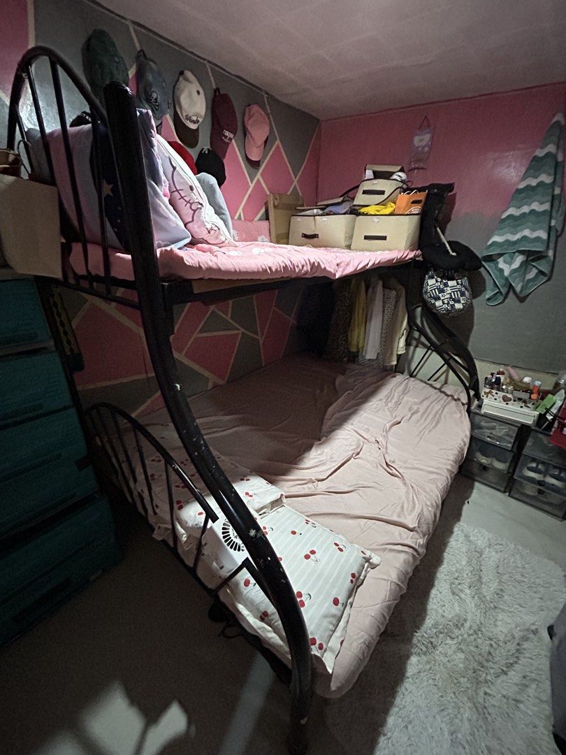 Double decked bed (Category: Bed Frames & Mattresses) located in Manila. Submitted by prlvdbypau (Listing ID 1461244247, Image 1). Description: Ps: don’t mind the things only the bed is selling -double size and king size - Sturdy metal bunk bed - Perfect for kids or shared rooms - Ladder included for easy access -og price is 9k -can do nego .