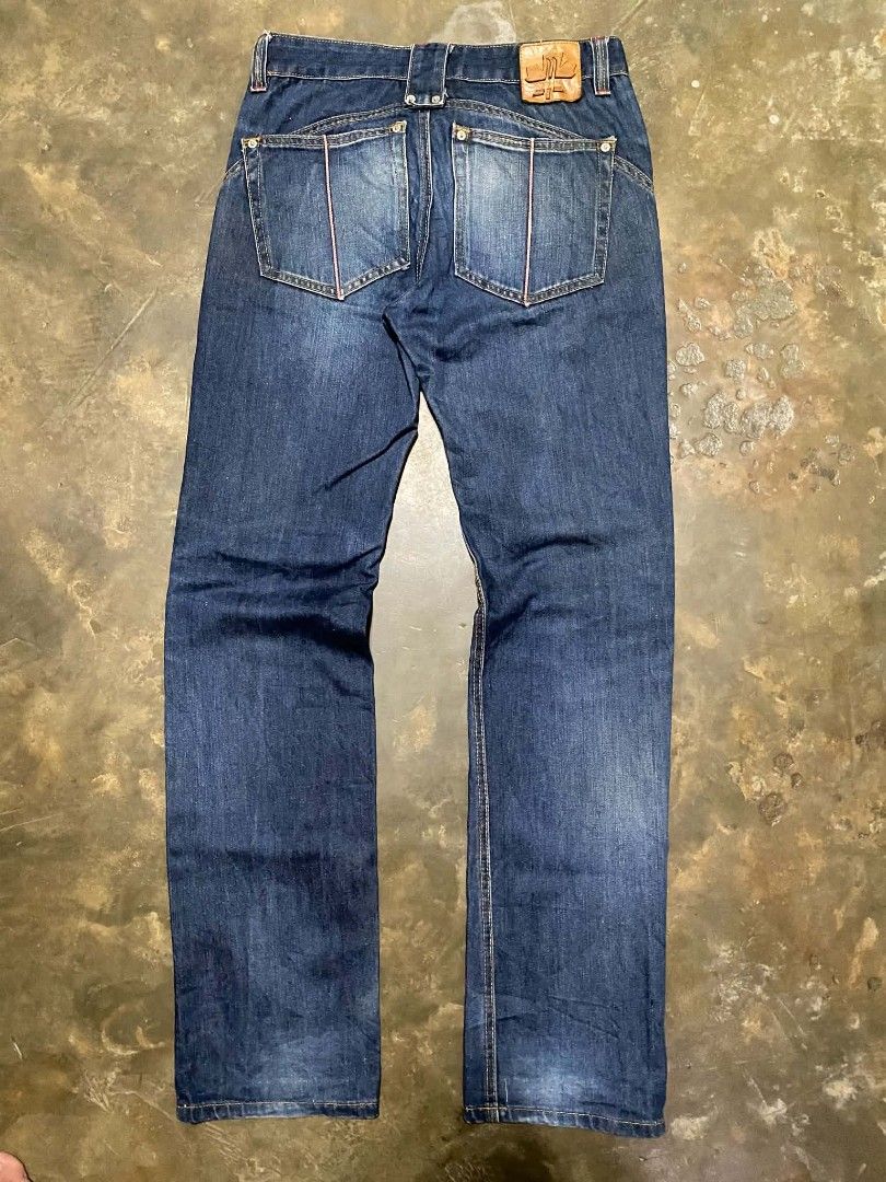 DSQUARED2 Men's Pants (Category: Jeans) located in Taguig. Submitted by althriftdailyloots94 (Listing ID 1461266264, Image 1). Description: - Size: 31 waist - Dark wash denim jeans - Classic five-pocket style - Iconic DSQUARED2 branding on button and leather patch - Red stitching detail on back pockets - Straight leg fit - Ideal for everyday wear issue: need wash .