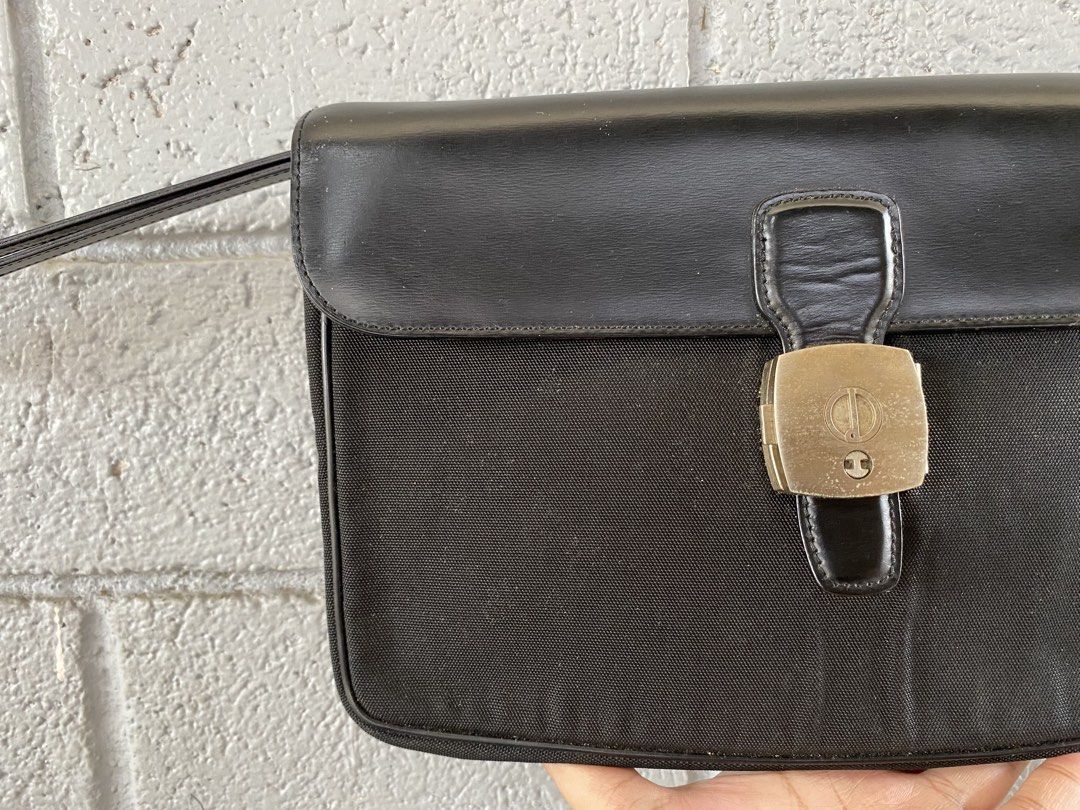 Dunhill Clutch Bag (Category: Purses & Pouches) located in Molave. Submitted by thrifthauls (Listing ID 1461205543, Image 2). Description: Signs of use only. Needs cleaning. Been keeping this for a while na. Genuine leather and canvas material. RFS: Decluttering Loc: Zamboanga del Sur, Mindanao.
