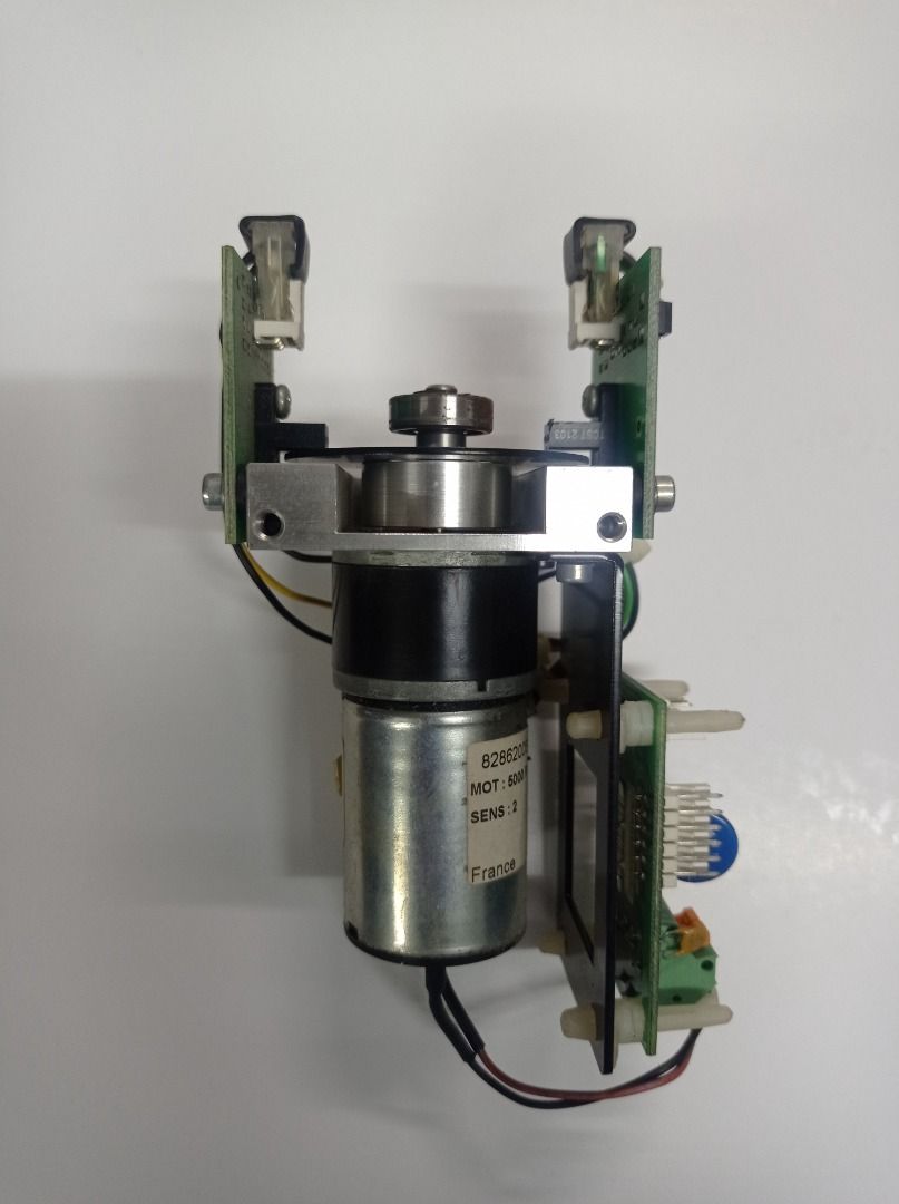 Durst Theta DC Geared Motors with Opto-Limit PCBs (Category: CDs & DVDs) located in Caloocan City. Submitted by agolito (Listing ID 1461236002, Image 2). Description: DURST THETA 24V DC GEARED MOTOR ASSEMBLIES WITH SENSOR PCBs Two original motor assemblies removed from a Durst Theta printing machine. Included: DC geared-motor assembly with Durst AB2094A optical-limit sensor PCB, mounting bracket, wiring and connectors. Larger geared-motor/clamp a