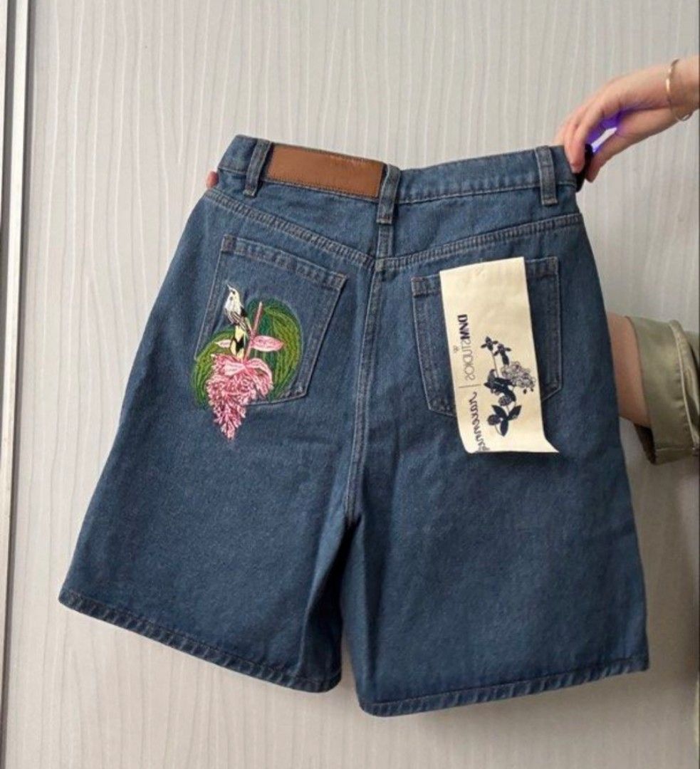 Plains and Prints Denim Shorts (Category: Shorts) located in Manila. Submitted by mariakelouise (Listing ID 1461267679, Image 3). Description: - Cute denim shorts from DVM Studios x raxenne - Classic blue denim color - Features beautiful embroided kingfisher and flower design on back pocket - Size S (28) - Original tags attached.