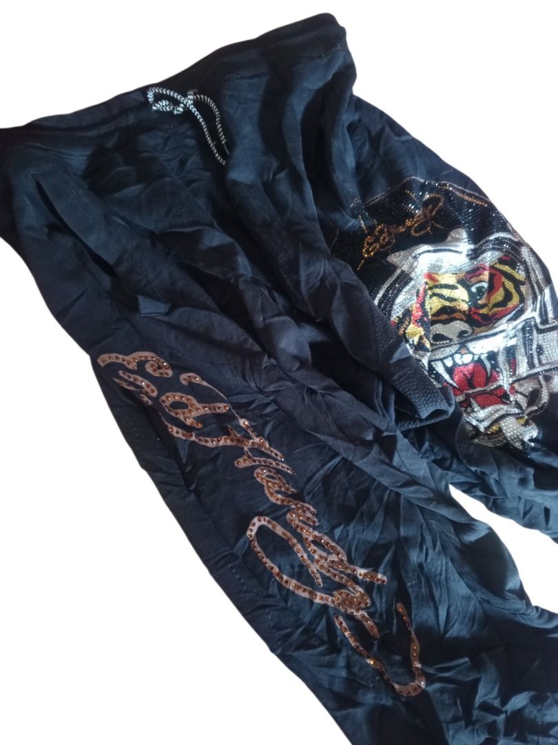 Ed Hardy Tiger & Skull Sweatpants (Category: Joggers) located in Caloocan City. Submitted by grandhorse-c5575b (Listing ID 1461223253, Image 1). Description: - Black Ed Hardy sweatpants - Features iconic tiger and skull graphic with sparkling rhinestones - Ed Hardy logo detail on the back - Comfortable drawstring waist - Ideal for a stylish casual look.