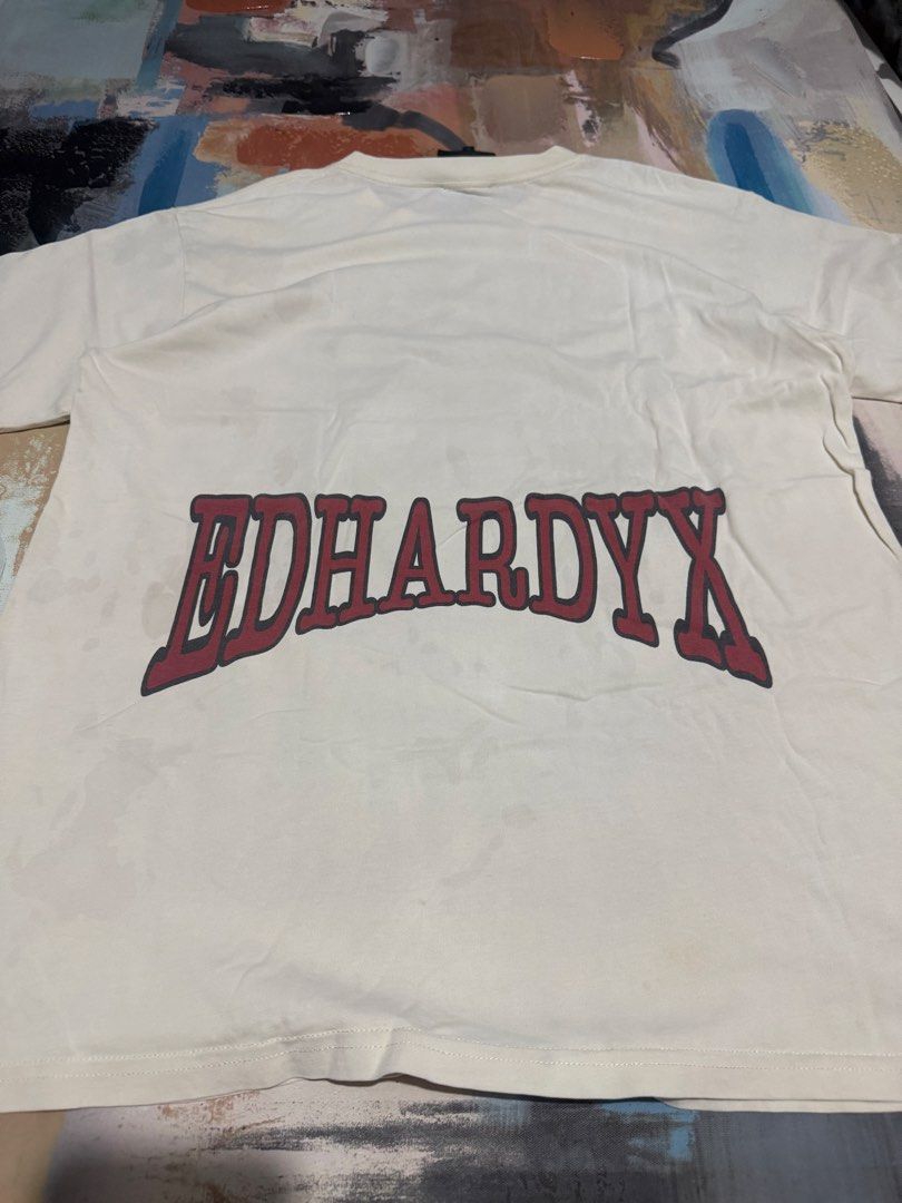 Eh Hardy tshirt (Category: Tshirts & Polo Shirts ) located in Las Pinas. Submitted by thrftmnl. (Listing ID 1461228579, Image 3). Description: Ed Hardy Size: L-XL Dimes Width: 22 Length: 30 Issue: stains removable.
