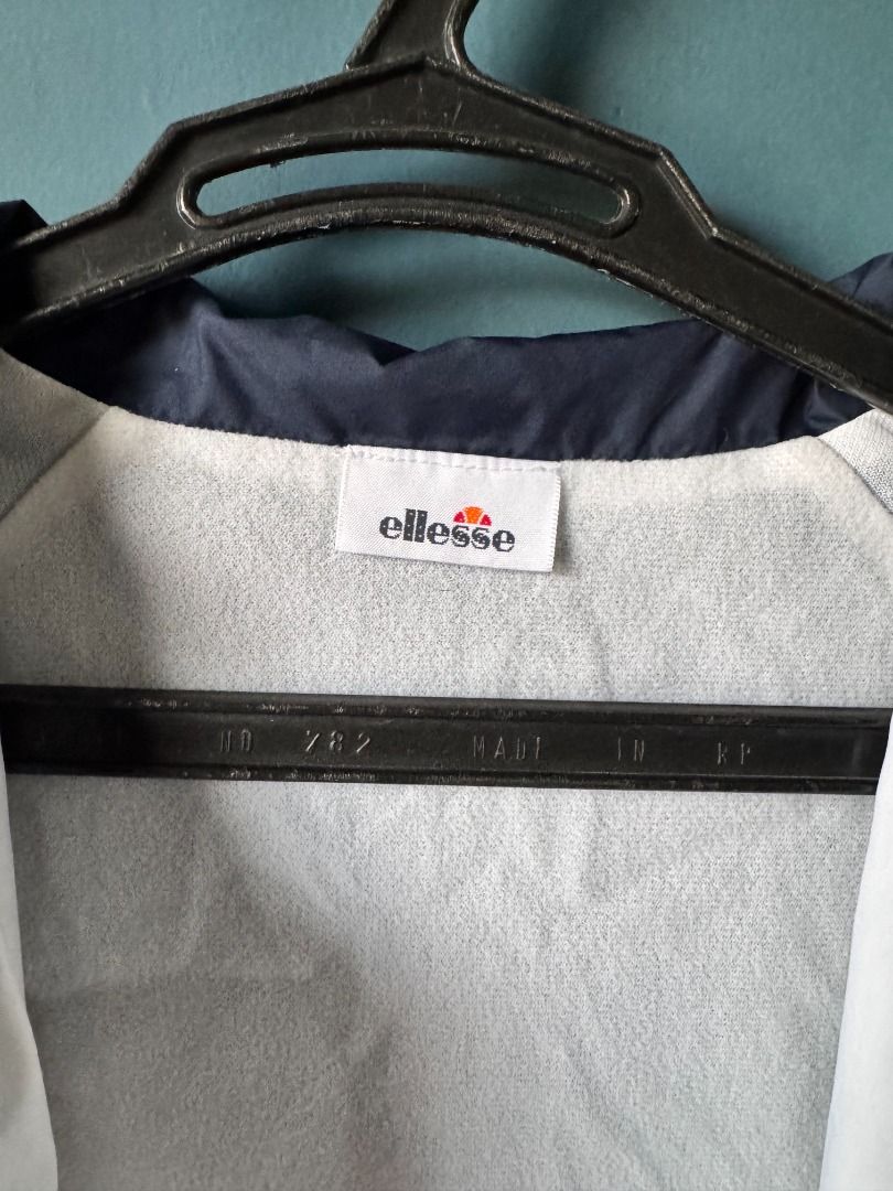 ellesse tennis jacket (white and navy) (Category: Coats, Jackets and Outerwear) located in Manila. Submitted by reesespiecess (Listing ID 1461275747, Image 3). Description: - white and navy ellesse tennis jacket - bought this at a japan outlet a few years ago - can't find the size on the tag but this best fits S-M - perfect jacket to wear on and off the court! - this was my lucky charm jacket when i used to play in tournaments so i hope it brings