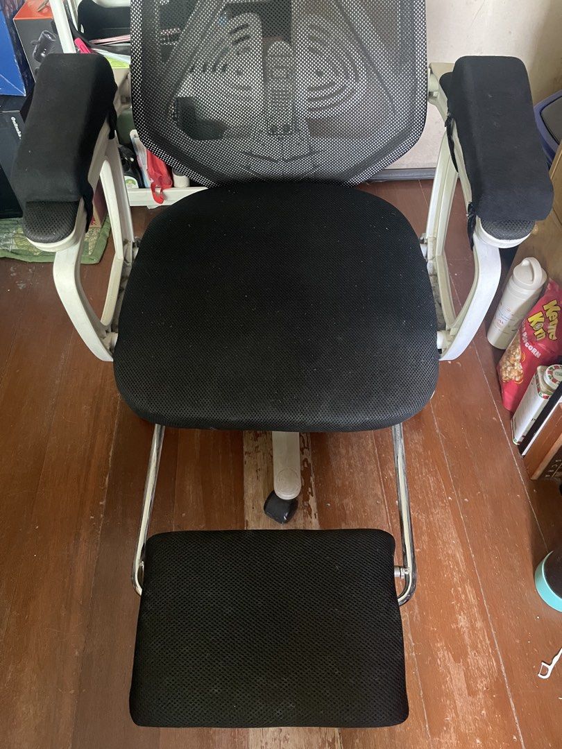 Ergonomic Mesh Office Chair with Footrest (Category: Office Furniture & Fixtures) located in Quezon City. Submitted by trickst3rzs (Listing ID 1461174675, Image 3). Description: - Ergonomic black mesh office chair - Adjustable headrest and armrests - Built-in pull-out footrest for added comfort - Smooth 360-degree swivel and rolling casters issues: - needs cleaning - may natanggal na screw sa may bandang upuan kaya nag lean forward kapag sa harap