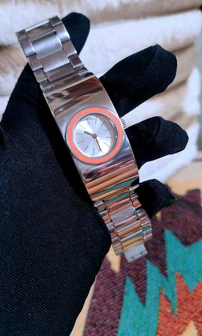 Esprit Watch Silver Tone with Orange Bezel (Category: Women's Watches) located in Baliuag. Submitted by marieannfernando23 (Listing ID 1461281256, Image 2). Description: - Esprit watch - Silver-tone metal band - Round face with bright orange bezel - Silver dial with simple hour markers and Esprit logo - Stylish accessory with a pop of color - Perfect for everyday wear or dressing up - Adjustable band.
