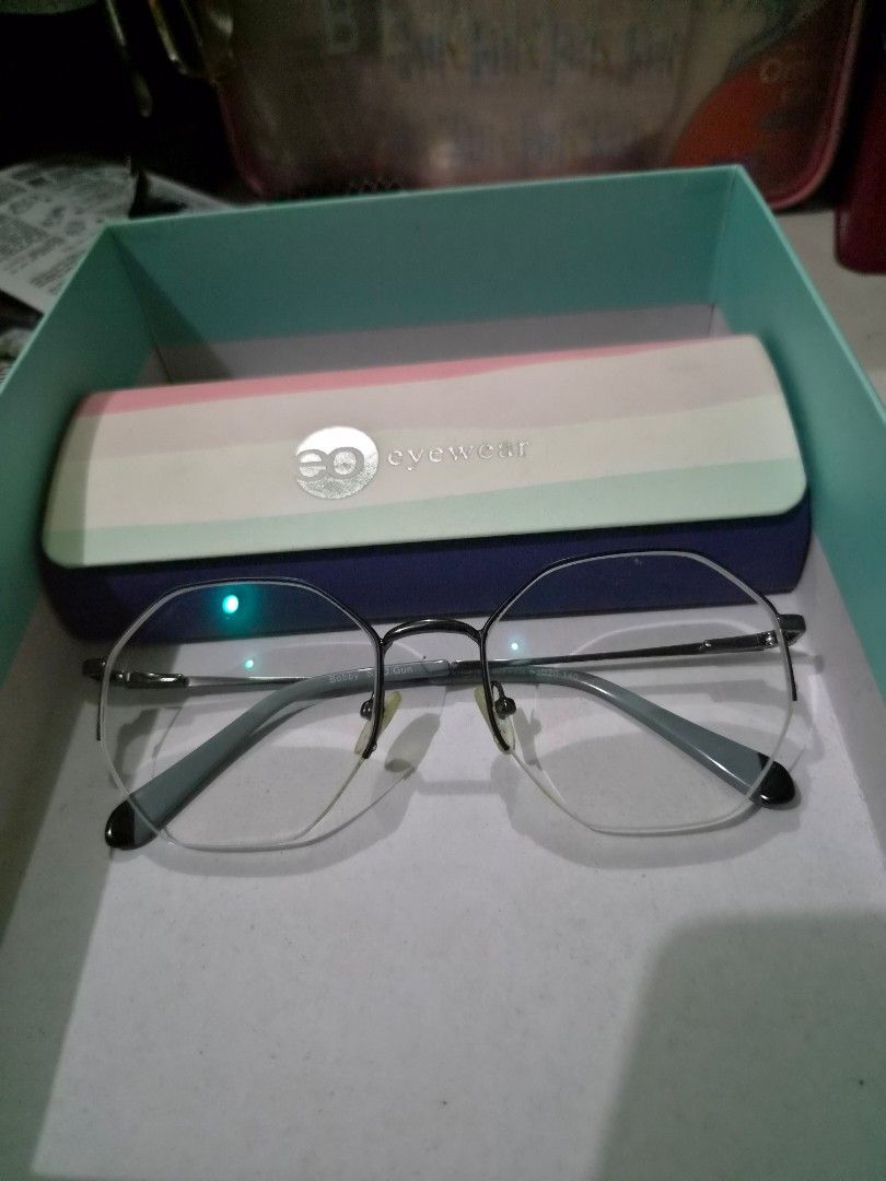 Executive Optical Eyewear Glasses Frame (Model: Bobby s.d.gun) (Category: Sunglasses & Eyewear) located in Makati City. Submitted by alinalenn (Listing ID 1461142476, Image 1). Description: Hep me declutter New, never used. Though may grado na yung lens, you can just have it changed sa stores. Bought it as b1t1 sa EO then i realized i like my old frames more. - Silver and grey frames - Clear lenses - Includes hard case and cleaning cloth - Perfec