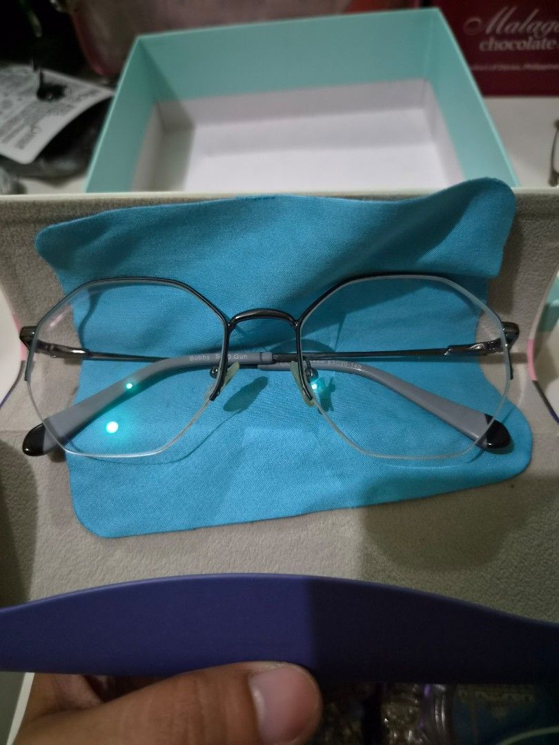 Executive Optical Eyewear Glasses Frame (Model: Bobby s.d.gun) (Category: Sunglasses & Eyewear) located in Makati City. Submitted by alinalenn (Listing ID 1461142476, Image 3). Description: Hep me declutter New, never used. Though may grado na yung lens, you can just have it changed sa stores. Bought it as b1t1 sa EO then i realized i like my old frames more. - Silver and grey frames - Clear lenses - Includes hard case and cleaning cloth - Perfec