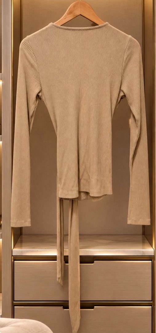 Express Ribbed Knit Long Sleeve Wrap Top (Category: Longsleeves) located in Cebu City. Submitted by classy82 (Listing ID 1461124723, Image 3). Description: - Express beige ribbed knit wrap top - Super soft and stretchy material - Long sleeves with a tie waist - Perfect for dressing up or down, or for layering.