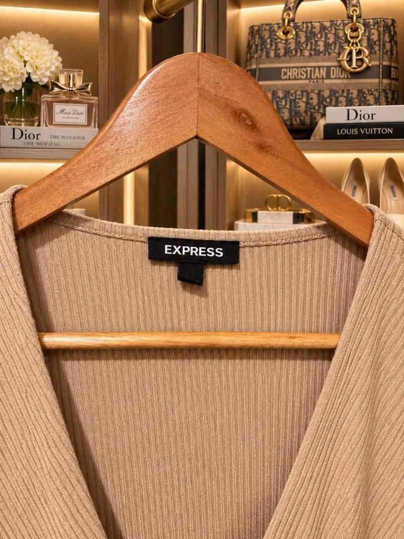Express Ribbed Knit Long Sleeve Wrap Top (Category: Longsleeves) located in Cebu City. Submitted by classy82 (Listing ID 1461124723, Image 2). Description: - Express beige ribbed knit wrap top - Super soft and stretchy material - Long sleeves with a tie waist - Perfect for dressing up or down, or for layering.