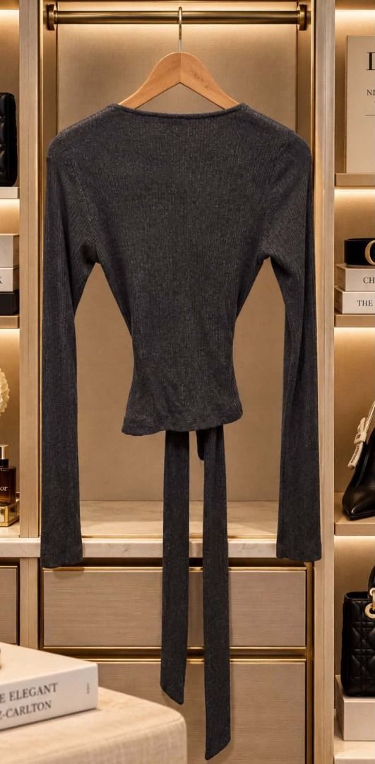 Express Ribbed Knit Wrap Top (Category: Blouses) located in Cebu City. Submitted by classy82 (Listing ID 1461124863, Image 2). Description: - Brand: Express - Color: Dark Grey - Material: Ribbed Knit - Style: Wrap Top - Features: Long sleeves, tie waist, subtle shimmer - Versatility: Perfect for dressing up or down, layering, or wearing alone..