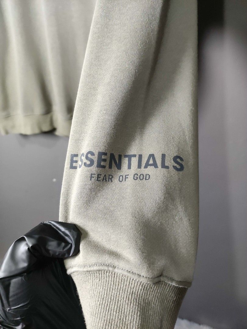 Fear of God Essentials Sweatshirt (Category: Activewear) located in Batangas. Submitted by andifits.ph (Listing ID 1461292831, Image 2). Description: Essentials sweatshirt - Size: Large "24 x 28" - Features brand name print on chest - Essentials logo on sleeve - Made in Vietnam - Material: 100% cotton - Care instructions: - Hand wash cold - Use non-chlorine bleach when needed - Flat dry - Do not iron.