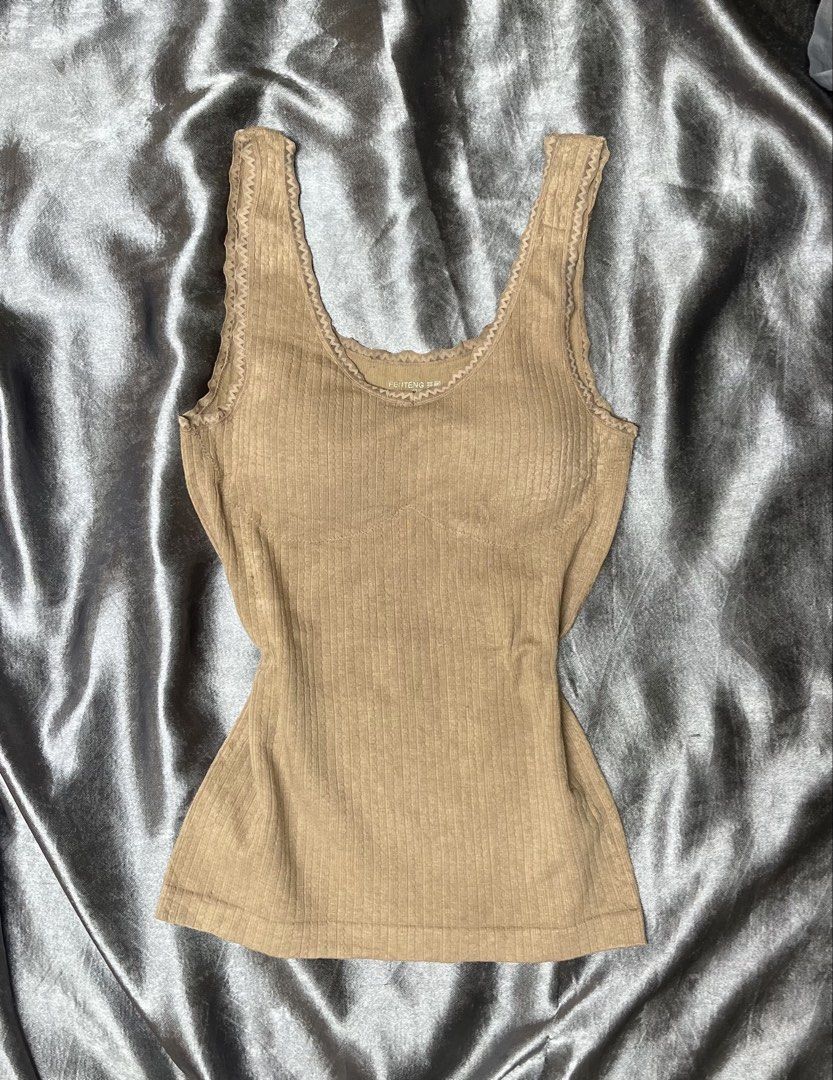 FEITENG Ribbed Tank Top with Lace Trim (Category: Sleeveless) located in Cavite. Submitted by bellewii (Listing ID 1461047756, Image 1). Description: - Dusty rose ribbed tank top - Delicate lace trim on neckline and armholes - Stretchy material for a comfortable fit - Estimated size M/L - Versatile for layering or wearing solo.