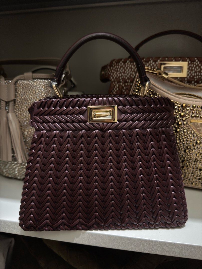Fendi Peekabo Sling Bag (Category: Luxury Bags & Wallets) located in Quezon City. Submitted by kingwolf824 (Listing ID 1461244066, Image 1). Description: Flash sale today only! Fendi Mini Peekaboo in this beautiful burgundy woven leather. Genuine leather, comes with dustbag and sling. Can be a top handle bag or a sling bag. Perfect for any event. No returns, No exchange, No refunds..